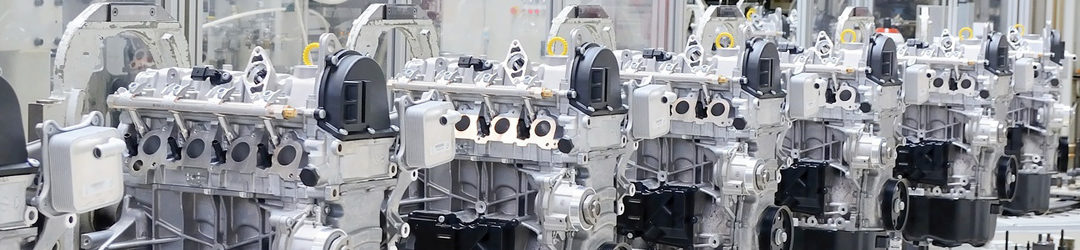 Photo of an automotive engine assembly line, showing how Blue Photon's Workholding System can be deployed in high-volume environments