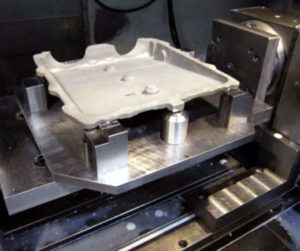 Photo of a Blue Photon pallet gripping a part during the machining process