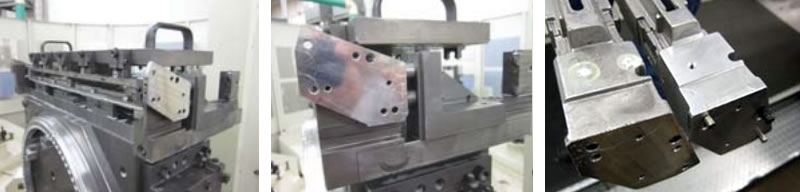 Photo of a long thin part being machined, secured via conventional mechanical clamps and Blue Photon grippers.