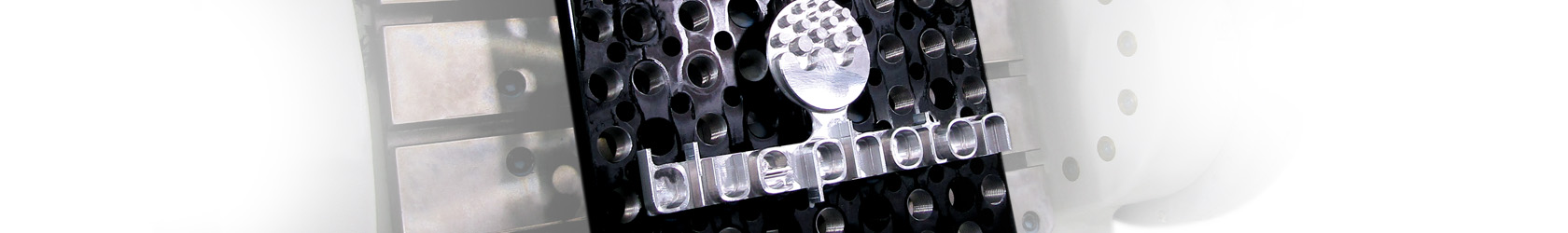The Blue Photon logo machined into a piece of metal