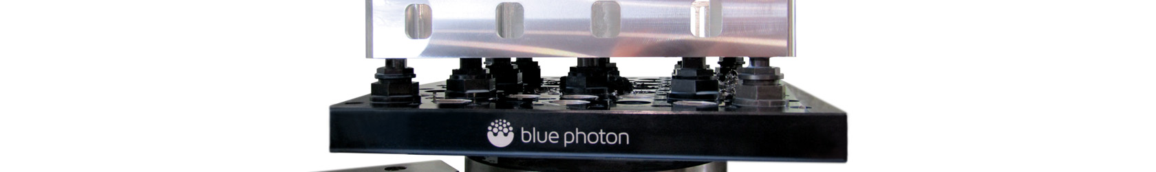 Photo of a Blue Photon gripper fixture securely holding a part