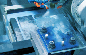 Photo of a part undergoing grinding, demonstrating how Blue Photon holds parts securely while dampening vibrations